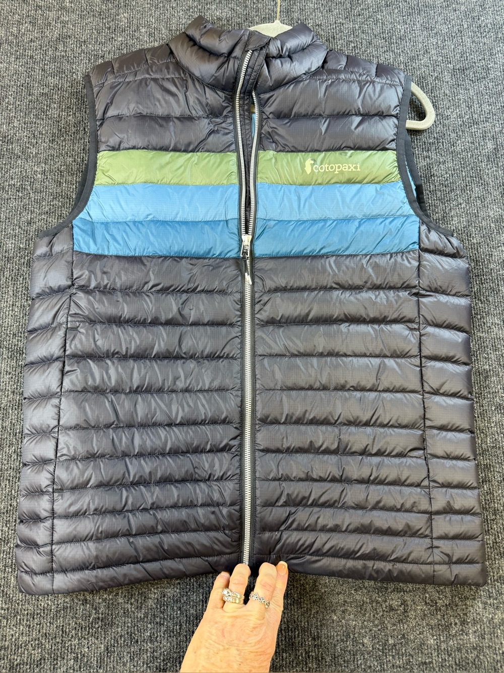Cotopaxi Womens black Puffer Vest with Green & Blue Chest Stripes
